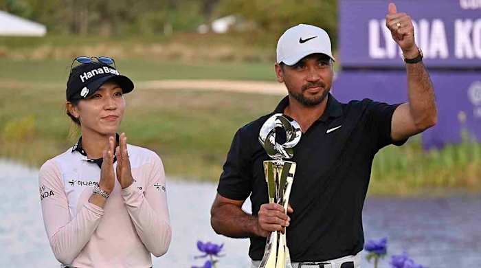 Lydia Ko, left, and Jason Day, right, celebrate with the championship trophy after winning the 2023 Grant Thornton Invitational in Naples, Fla.